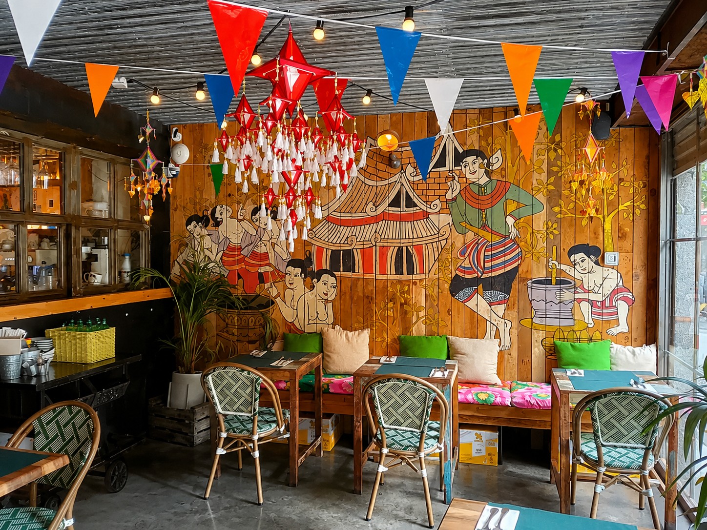 The colourful Isan mural dining area at THAI ISAAN